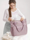 Borsa a spalla capiente e versatile di colore viola